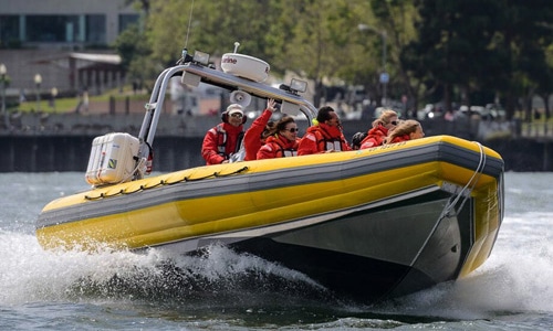 Passengers enjoying a speedboat tour on San Francisco Bay